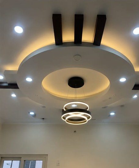 Finished false ceiling with cove lighting, spotlights and a circular centrepiece