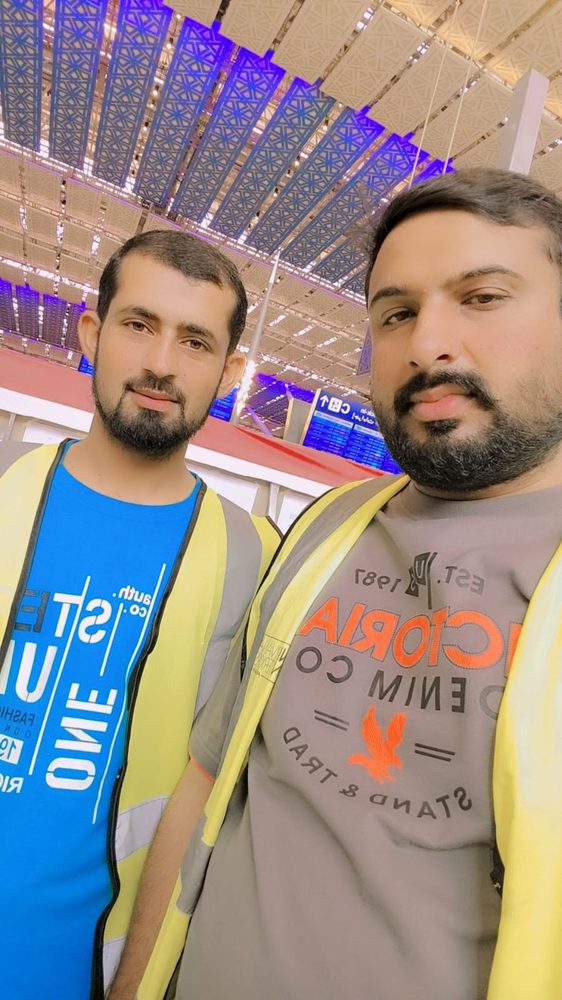 Two Umar Technical Services technicians in high-visibility vests on site